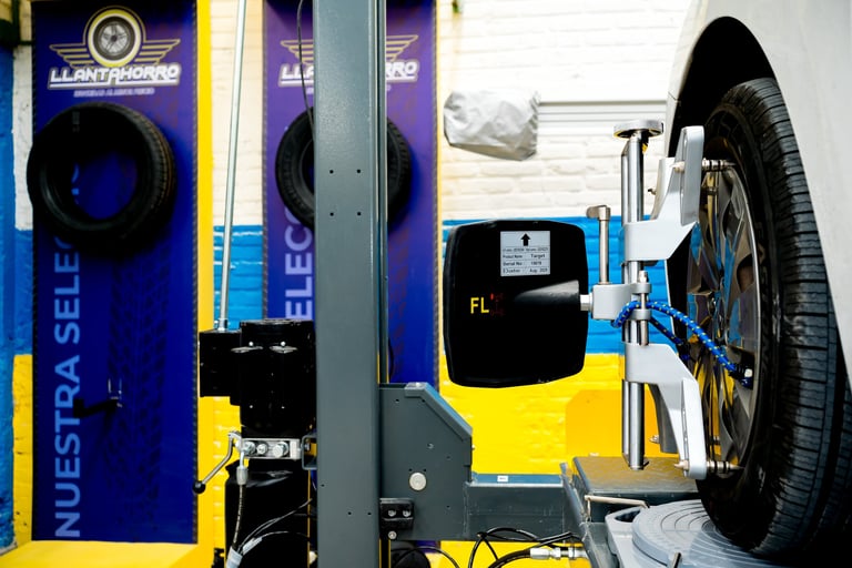 Bicycle repair stand with blue and yellow frame holding a bike wheel for maintenance or tire service.
